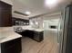 Open concept kitchen featuring stainless steel appliances, tile backsplash and views into the living room at 3803 43Rd N Ave, St Petersburg, FL 33714