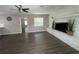 Open floor plan living room with stone fireplace and luxury vinyl plank flooring at 3803 43Rd N Ave, St Petersburg, FL 33714