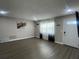 A bright living room with hard floors, natural light, and neutral paint is move-in ready at 3803 43Rd N Ave, St Petersburg, FL 33714