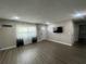 Living room featuring a front door, modern lighting, and luxury vinyl plank flooring at 3803 43Rd N Ave, St Petersburg, FL 33714