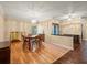 Inviting dining area with wood floors, chandelier lighting and bright ambiance at 4118 Carrollwood Village Dr, Tampa, FL 33618