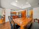 Lovely dining area with wood table, chairs, and access to the kitchen at 4118 Carrollwood Village Dr, Tampa, FL 33618