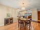 Charming dining room with wood floors and a view of the kitchen at 4118 Carrollwood Village Dr, Tampa, FL 33618
