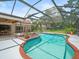 Backyard pool and patio area with privacy fence and beautiful lawn at 4118 Carrollwood Village Dr, Tampa, FL 33618