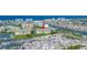 Aerial view of a condo in a vibrant waterfront community with extensive boat storage and nearby amenities at 423 150Th Ave # 1501, Madeira Beach, FL 33708
