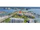 Stunning aerial view shows waterfront condo community, surrounded by the ocean and a marina at 423 150Th Ave # 1501, Madeira Beach, FL 33708