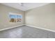 Bedroom featuring a ceiling fan, tile flooring, and view of the city at 423 150Th Ave # 1501, Madeira Beach, FL 33708