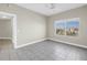 Bedroom with ceiling fan, tile flooring, and view of the city at 423 150Th Ave # 1501, Madeira Beach, FL 33708