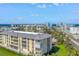 Exterior angled view showing the well maintained building with street and coastal views at 423 150Th Ave # 1501, Madeira Beach, FL 33708