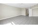 Spacious living room featuring tile flooring, a ceiling fan, and an open doorway at 423 150Th Ave # 1501, Madeira Beach, FL 33708