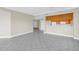 Open-concept living area with tile flooring, a breakfast bar, and a view to the kitchen at 423 150Th Ave # 1501, Madeira Beach, FL 33708