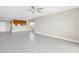 Bright, open living room with tile floors that lead to an eat-in kitchen with modern appliances at 423 150Th Ave # 1501, Madeira Beach, FL 33708