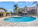 Inviting kidney bean pool area features lounge chairs, a spa, and a shaded pavilion for relaxing by the water at 423 150Th Ave # 1501, Madeira Beach, FL 33708