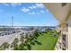 Stunning water view from a high rise condo, with boats, lawn, and blue skies at 423 150Th Ave # 1501, Madeira Beach, FL 33708