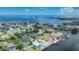 Aerial view of waterfront homes with a pin marking the property, set in a scenic coastal community at 4279 Newport Dr, Hernando Beach, FL 34607