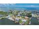 Drone's-eye view of waterfront homes, illustrating the prime real estate location with dock access at 4279 Newport Dr, Hernando Beach, FL 34607