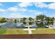 Waterfront backyard with dock and scenic water views from lush lawn at 4279 Newport Dr, Hernando Beach, FL 34607