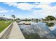 Waterfront backyard with lush grass and dock on canal, perfect for boating at 4279 Newport Dr, Hernando Beach, FL 34607