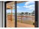 Balcony featuring a wood floor and railing with views of the lake at 4279 Newport Dr, Hernando Beach, FL 34607