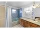 Blue-themed bathroom featuring a blue bath tub and a vanity with ample storage at 4279 Newport Dr, Hernando Beach, FL 34607
