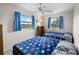 Bedroom featuring 2 twin beds with unique blanket designs and 2 windows at 4279 Newport Dr, Hernando Beach, FL 34607