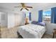 This bedroom is bright with blue curtains and a view of the waterway at 4279 Newport Dr, Hernando Beach, FL 34607