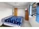 Bedroom featuring a full bed with a unique blanket design and a window at 4279 Newport Dr, Hernando Beach, FL 34607
