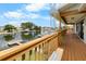 Relax on the wooden deck with beautiful canal views and lush greenery at 4279 Newport Dr, Hernando Beach, FL 34607