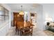 Bright dining room with an ornate hutch and dining set next to the kitchen at 4279 Newport Dr, Hernando Beach, FL 34607