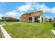 Spacious elevated home with multiple decks and lush lawn, perfect for outdoor living at 4279 Newport Dr, Hernando Beach, FL 34607