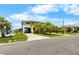 Charming home with carport, stairs leading to the front door, and lush green lawn at 4279 Newport Dr, Hernando Beach, FL 34607
