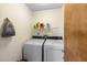 Laundry room featuring a washer and dryer with a wire rack above for storage at 4279 Newport Dr, Hernando Beach, FL 34607