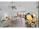 Bright living room with vaulted ceilings, a ceiling fan, sliding glass doors, and neutral flooring at 4279 Newport Dr, Hernando Beach, FL 34607