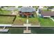 Waterfront home featuring a spacious elevated deck and a private dock for boating and relaxing by the water at 4279 Newport Dr, Hernando Beach, FL 34607