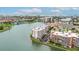 Breathtaking aerial view of waterfront condos with private boat slips and city skyline in the distance at 450 Treasure Isle Causeway # 411, Treasure Island, FL 33706