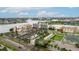 Aerial view of multi-story building complex with parking lots and waterways at 450 Treasure Isle Causeway # 411, Treasure Island, FL 33706