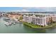 Stunning aerial view of waterfront condos with private boat slips offering picturesque water access at 450 Treasure Isle Causeway # 411, Treasure Island, FL 33706