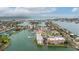Exceptional aerial perspective reveals waterfront condos with boat slips in a vibrant coastal community at 450 Treasure Isle Causeway # 411, Treasure Island, FL 33706