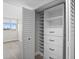 Walk-in closet with custom shelving for optimal storage at 450 Treasure Isle Causeway # 411, Treasure Island, FL 33706