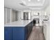 Updated kitchen featuring stainless steel appliances, white cabinetry, tile backsplash, and center island at 450 Treasure Isle Causeway # 411, Treasure Island, FL 33706