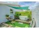 Backyard features a freestanding tub with lush greenery, providing a serene retreat for relaxation at 4518 Ashmore Dr, Tampa, FL 33610