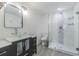 Modern bathroom features vessel sink, dark cabinets, and glass enclosed shower with decorative tile accent at 4518 Ashmore Dr, Tampa, FL 33610