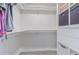 Walk-in closet with built-in shelving and organizers, and ample space for clothing and storage at 4518 Ashmore Dr, Tampa, FL 33610