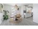 Bright dining area featuring a modern table with stylish chairs and natural light, seamlessly flowing from kitchen at 4518 Ashmore Dr, Tampa, FL 33610