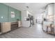 Modern kitchen with stainless steel appliances, white cabinets, and sleek countertops, flowing to eating area at 4518 Ashmore Dr, Tampa, FL 33610