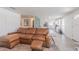 Open-concept living area with a large sectional sofa and seamless transition to the kitchen at 4518 Ashmore Dr, Tampa, FL 33610