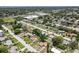 An aerial shot showcases a dense, residential neighborhood with a mix of colorful homes and lush trees at 525 38Th S St, St Petersburg, FL 33711