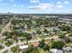 See a residential neighborhood with well-maintained homes, green trees, and distant city skyline at 525 38Th S St, St Petersburg, FL 33711