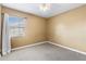 Bright bedroom featuring carpeted floors and a window providing natural light at 525 38Th S St, St Petersburg, FL 33711