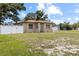 Well-maintained single-Gathering home featuring a fenced-in yard and a tidy lawn at 525 38Th S St, St Petersburg, FL 33711